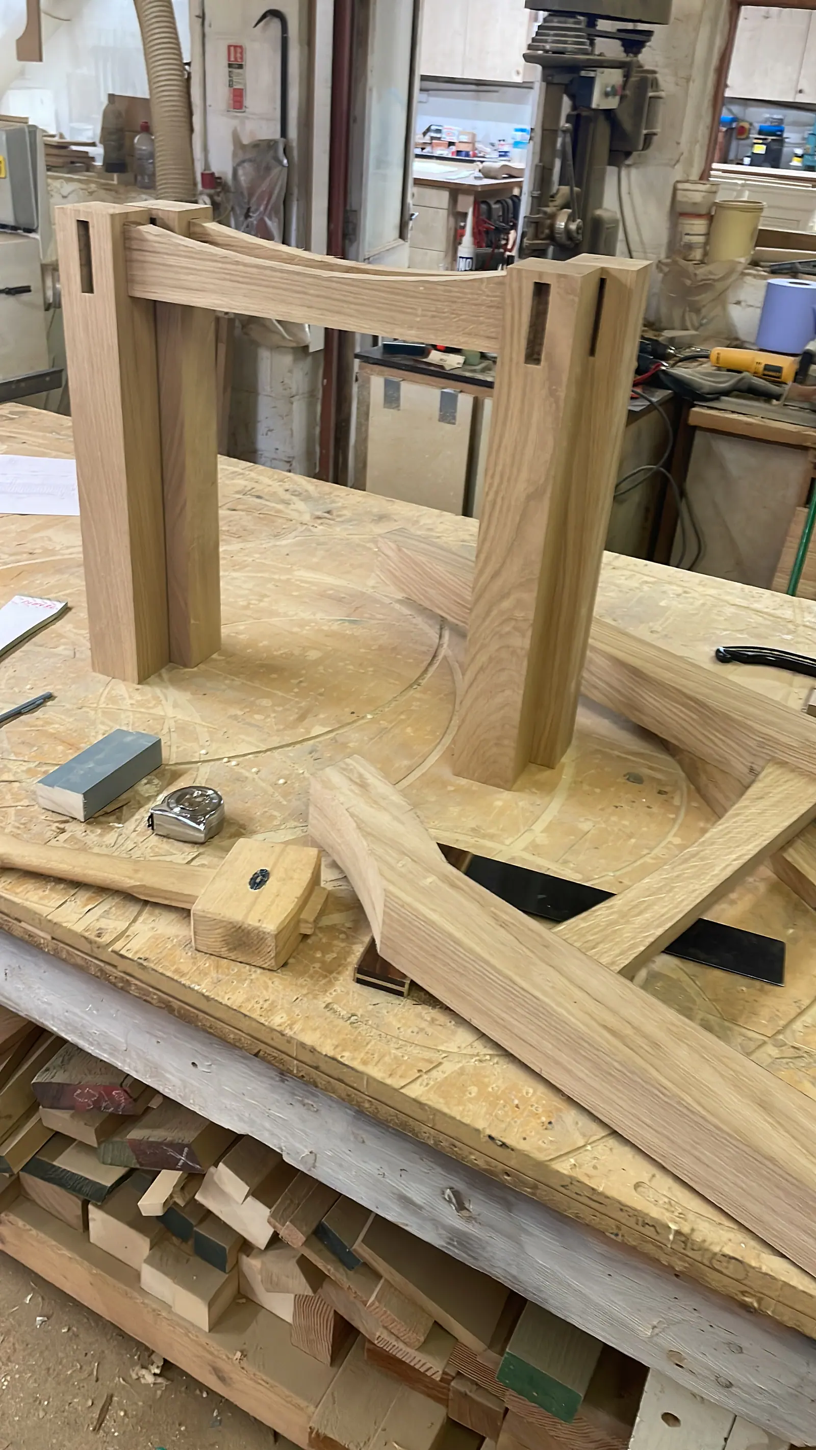 Master cabinetmaker working on bespoke wood furniture in Norfolk workshop